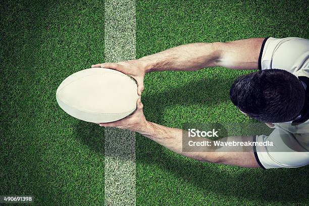 Imagen Compuesta De Un Jugador De Rugby Puntuación Pruebe Foto de stock y más banco de imágenes de Rugby - Deporte