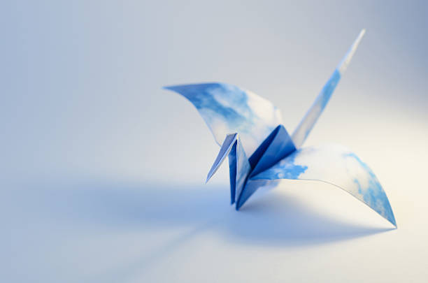 istock Blue sky origami bird 490691750