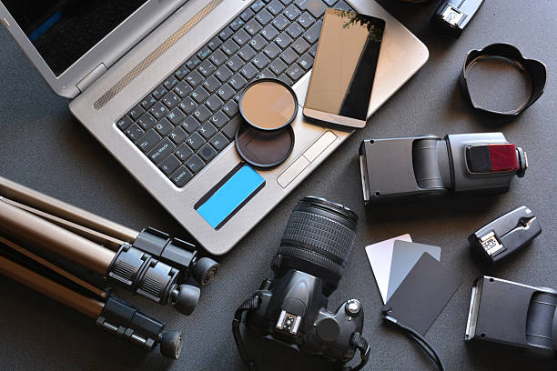 istock desktop with photography equipment 490692068