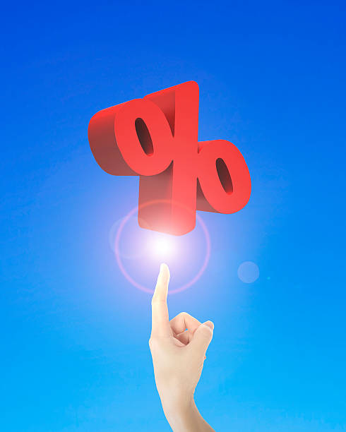 istock Human finger pointing at 3D red percentage sign 490692254