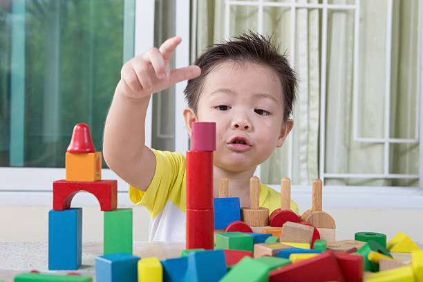 istock three-year child plays with toy blocks 490692287