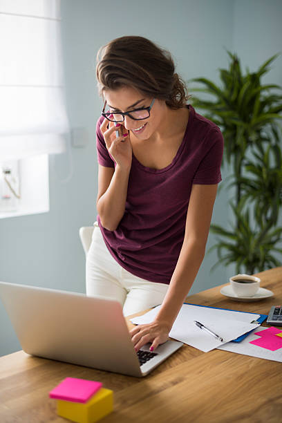 istock Young adult woman talking with her client 490692500