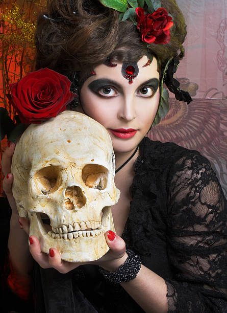 istock Woman with roses and skull 490693525