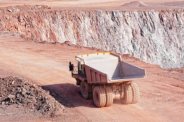 istock dumper truck on road in surface mine quarry 490693561