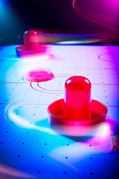 istock Dramatic lit air hockey table with light trails 490694645
