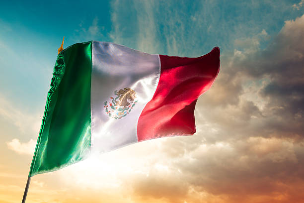 istock Mexican flag against a bright sky, independence day 490694649