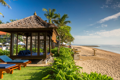 Luxurious bungalows of a resort facing the sea, Bali, Indonesia.