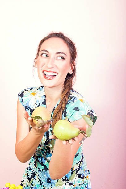beautiful girl holding a pears