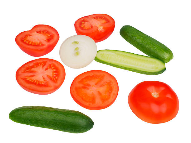 istock Tomatoes cucumbers onions vegetables on a white background 490695249