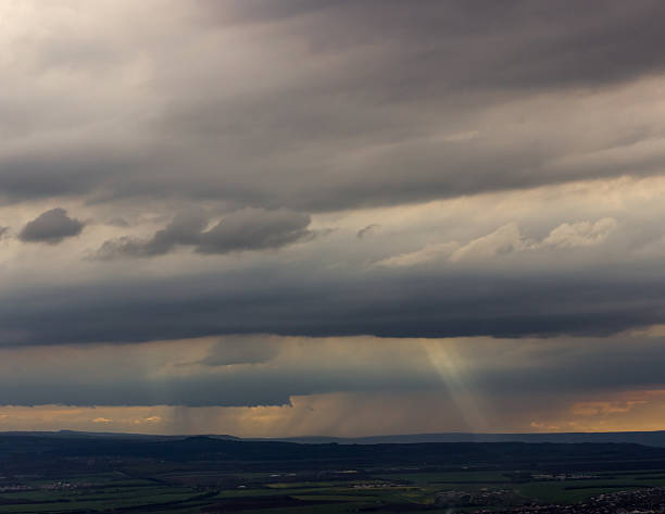 istock rays of the sun broke through the storm clouds 490695994