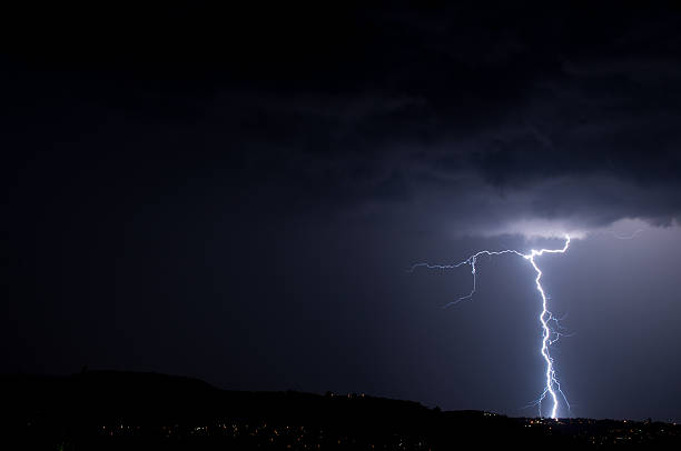 istock Lightning strike, cloud to ground in night skies 490696249