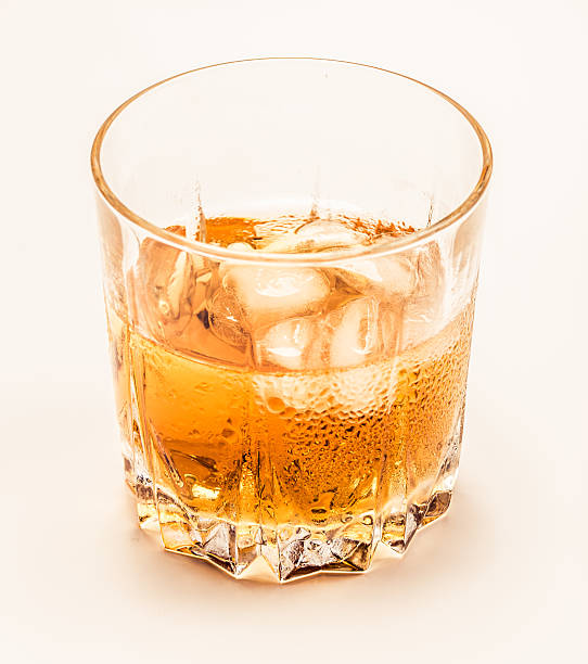 istock Glass of cold whiskey on white 490696422