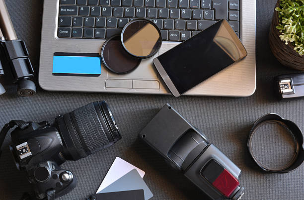 istock desktop with photography equipment 490697790