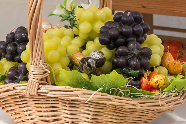 istock white and red bunch of grapes imitation in wicker basket 490697992