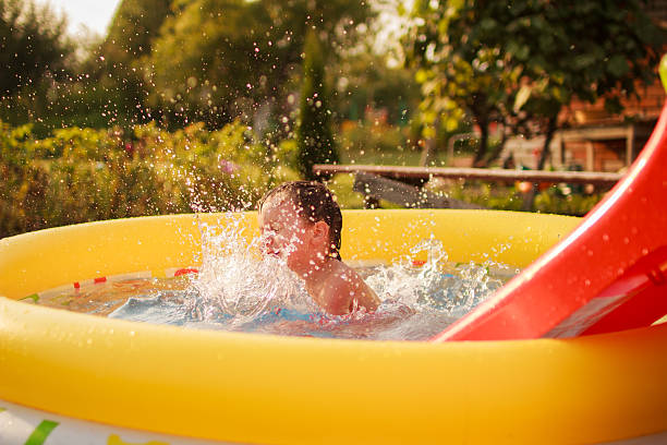 istock Happy child bathes in a pool. 490714146