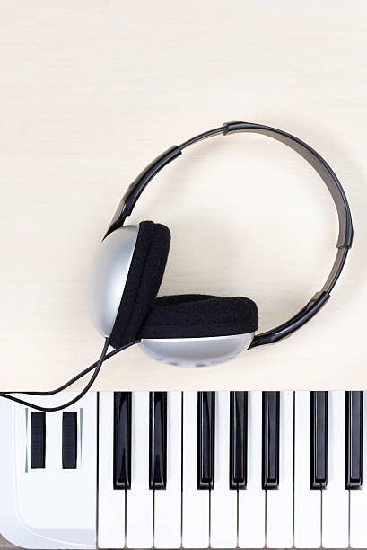 istock stereo headphone on piano 490715692