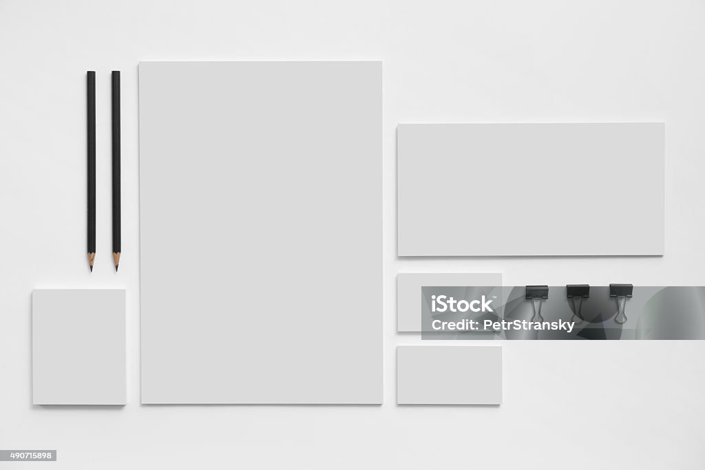 Blank branding mockup with gray business cards on white Blank branding mockup with gray business cards, envelopes and notepads isolated on white background. Template Stock Photo