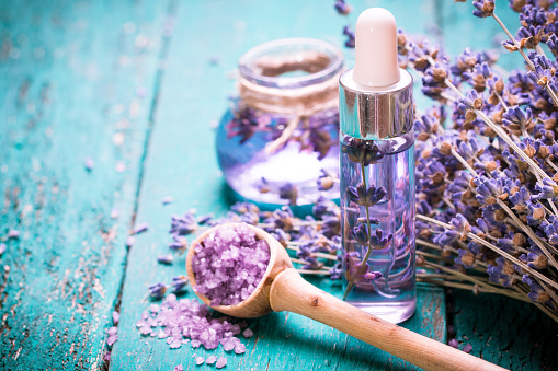 lavender flower,oil,salt, spa beauty concept. wood old background.