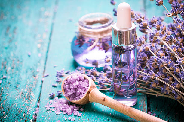 lavender flower,oil,salt, spa beauty concept. wood old background. - 香精油 個照片及圖片檔