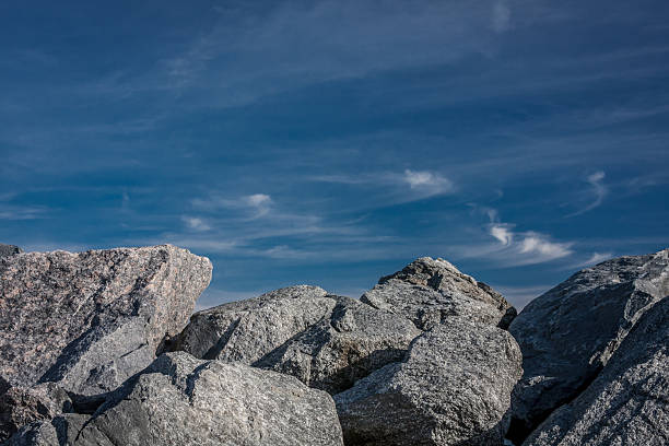 Gray Boulders and Blue Sky with Wispy Clouds