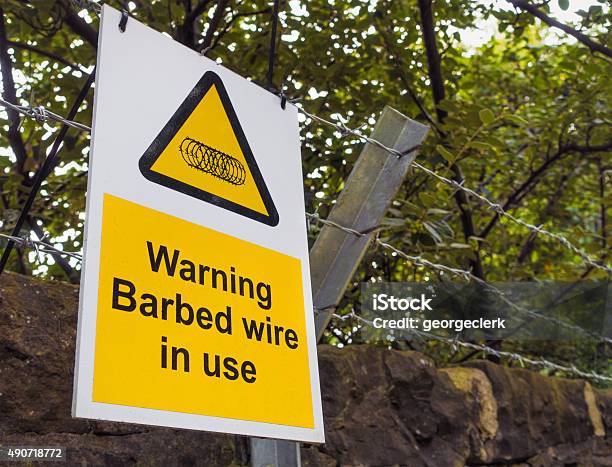 Barbed Wire Warning Sign Stock Photo - Download Image Now - 2015, Barbed Wire, Boundary