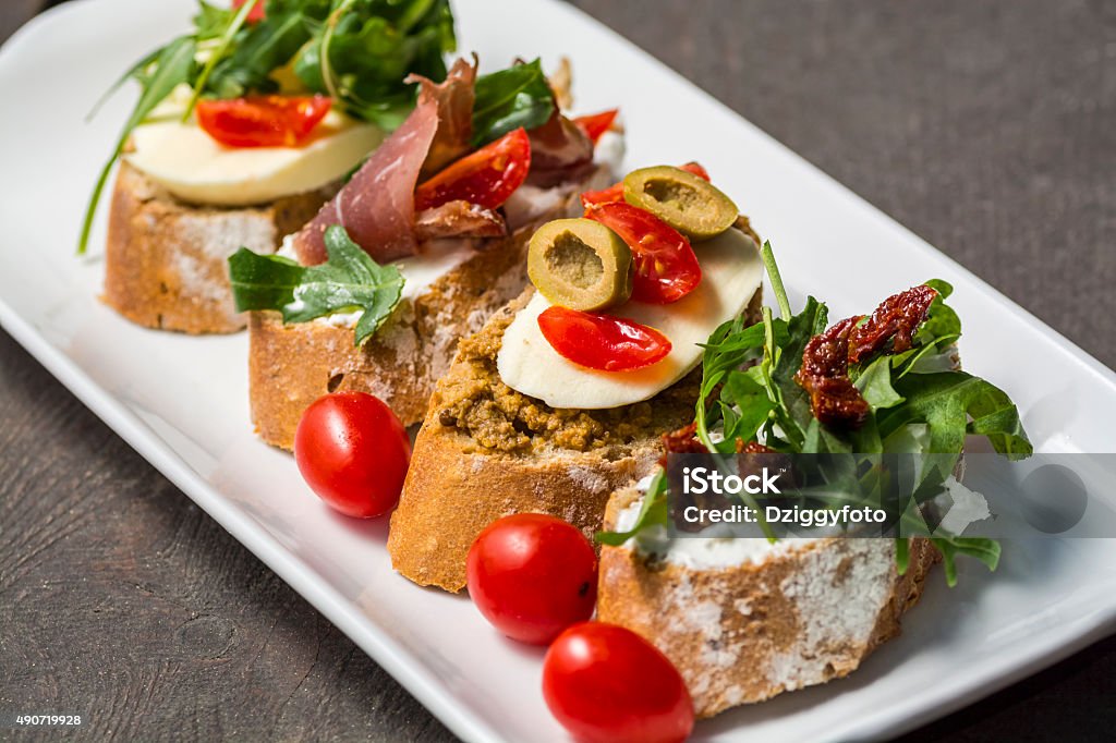 close up of sandwiches on a plate close-up of sandwiches on a plate on a wooden table Aperitif Stock Photo