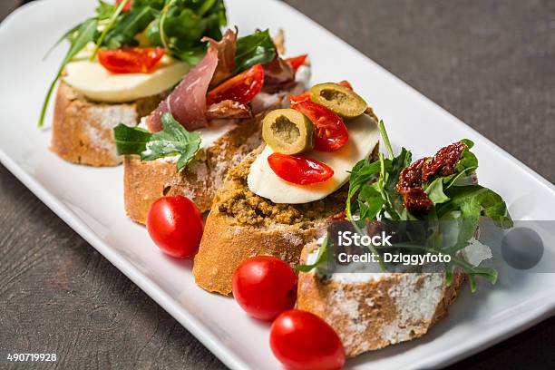 Close Up Of Sandwiches On A Plate Stock Photo - Download Image Now - Aperitif, Side Dish, Table