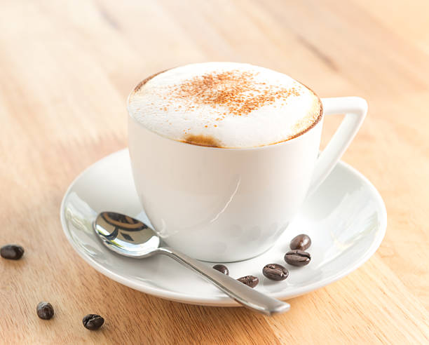 istock Cappuccino or latte coffee in cup with frothed on table 490720548