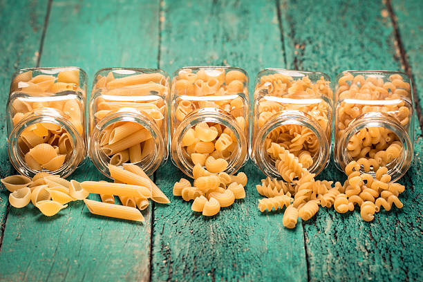 istock Various mix of pasta on wooden rustic background. 490720992
