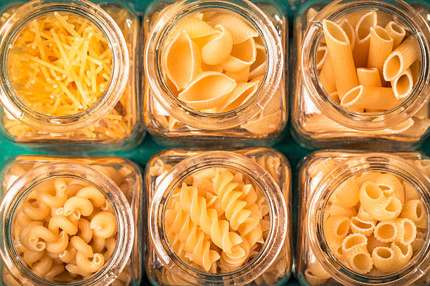 istock Various mix of pasta on wooden rustic background. 490722274