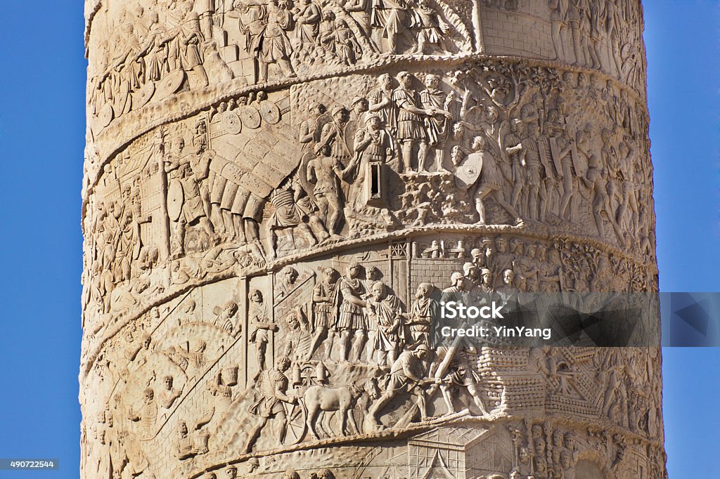 Details of Bas Relief of Trajan's Column in Rome, Italy The Trajan's Column. A historic monument in the ancient Roman empire. Completed in 133 AD, the bas relief on the column depicts scenes from the wars between the Romans and Dacians, Commemorating the Roman emperor Trajan conquest. Photograph of the details in close-up of the bas relief in the Trajan's Forum in Rome, Italy Trajan's Column Stock Photo
