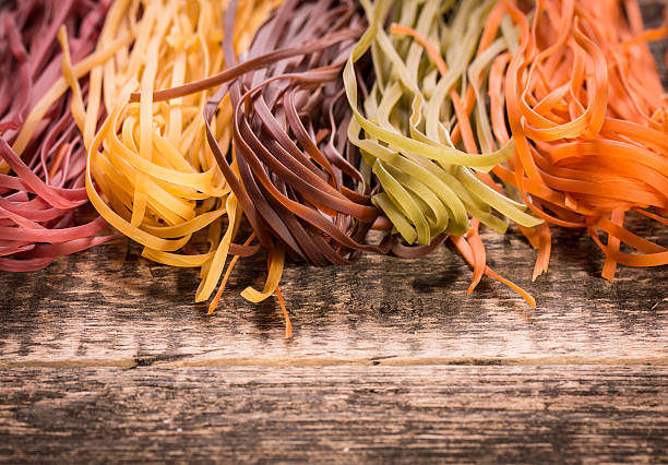 istock Various mix of pasta on wooden rustic background. 490722920