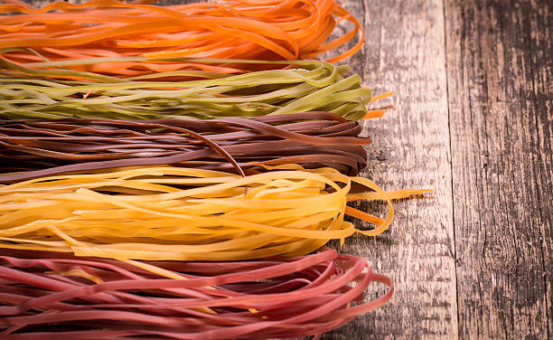 istock Various mix of pasta on wooden rustic background. 490723096
