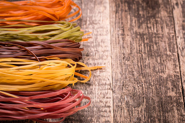 istock Various mix of pasta on wooden rustic background. 490723142