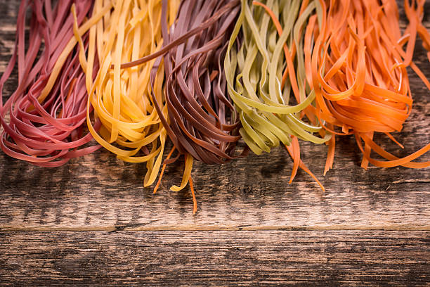 istock Various mix of pasta on wooden rustic background. 490723356