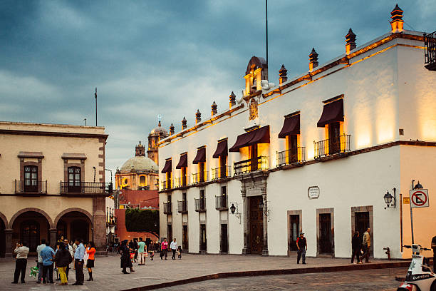 Santiago de Queretaro, Mexico - August 17, 2015: People going for a walk on the Independence Square in central Queretaro.