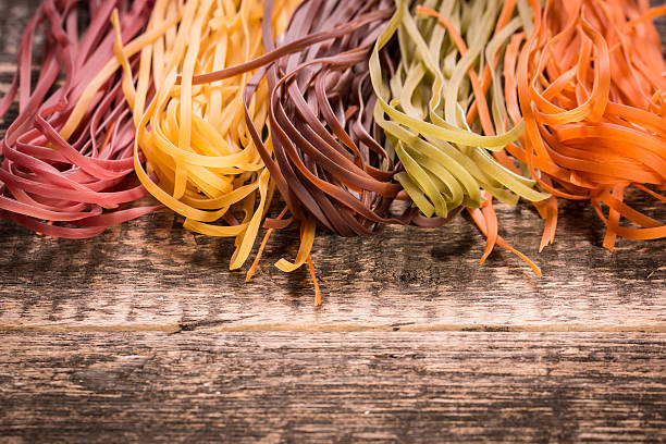 istock Various mix of pasta on wooden rustic background. 490723398