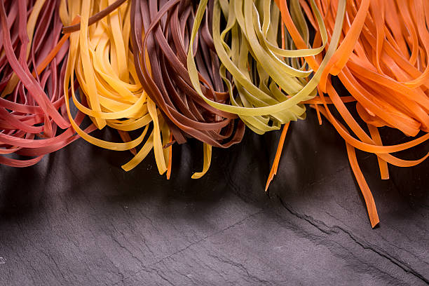 istock Various mix of pasta on wooden rustic background. 490723446