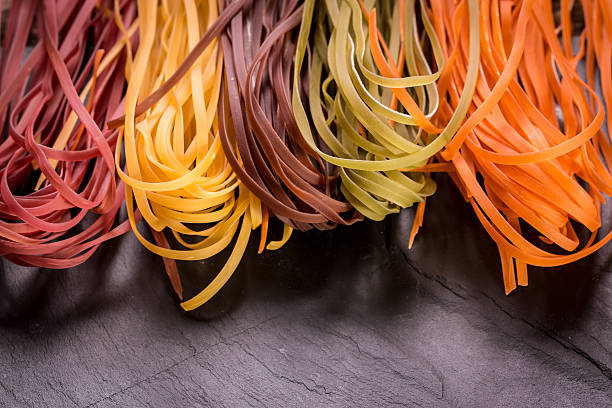 istock Various mix of pasta on wooden rustic background. 490723474
