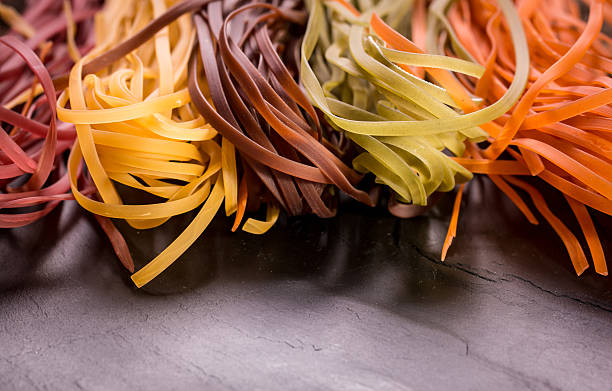 istock Various mix of pasta on wooden rustic background. 490723514