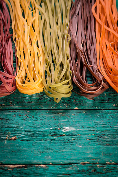 istock Various mix of pasta on wooden rustic background. 490723952