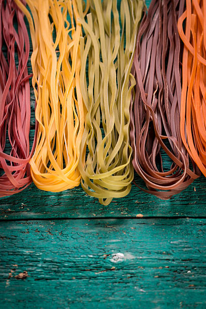 istock Various mix of pasta on wooden rustic background. 490723992