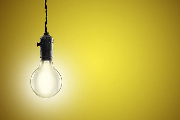 istock Idea concept - Vintage incandescent bulb on yellow background 490724548