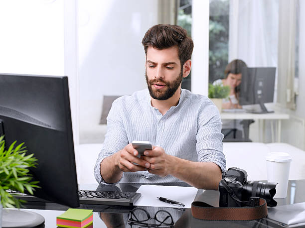 istock Young businessman with mobile phone 490725324