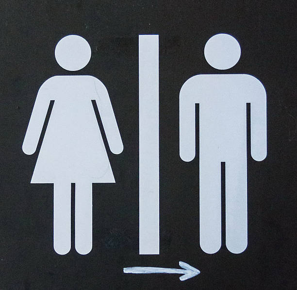 istock Toilet sign  and diraction on black metal shield 490726456