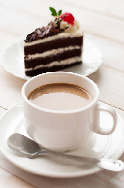 cup of cafe latte and cake stock photo