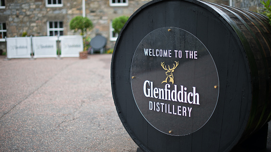 Dufftown, Scotland - August 1, 2013: Entrance of Glenfiddich distillery, Dufftown. Glenffidich is one of the most important whisky label of the world and accept visitor for free at its plants.