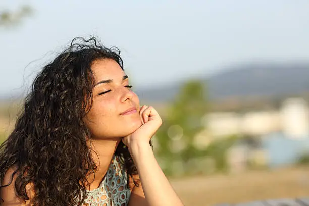 Photo of Woman relaxing in a warmth park