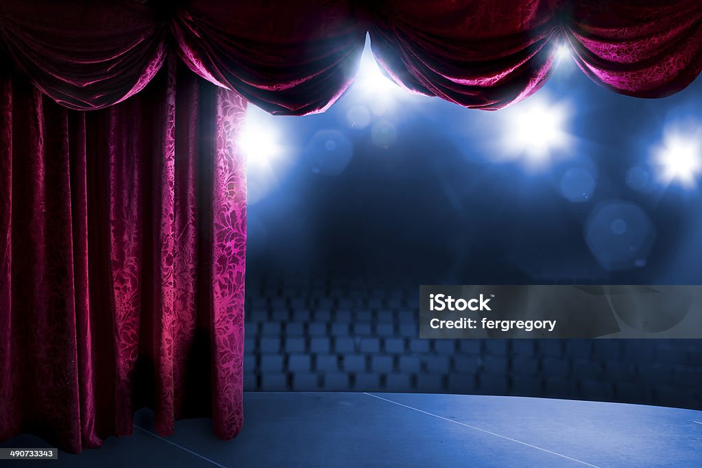 Theater curtain with dramatic lighting Theater curtain with dramatic lighting and lens flare Theatrical Performance Stock Photo