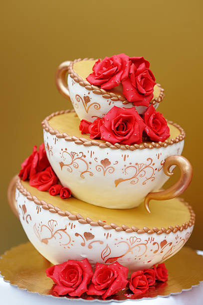 Wedding cake Delicious original wedding cake decorated with red flowers white wedding cake red roses stock pictures, royalty-free photos & images